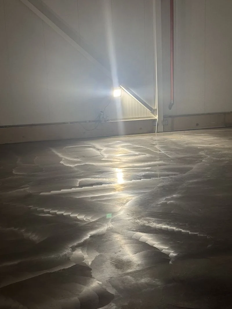 Polished concrete floor, lantern in the background